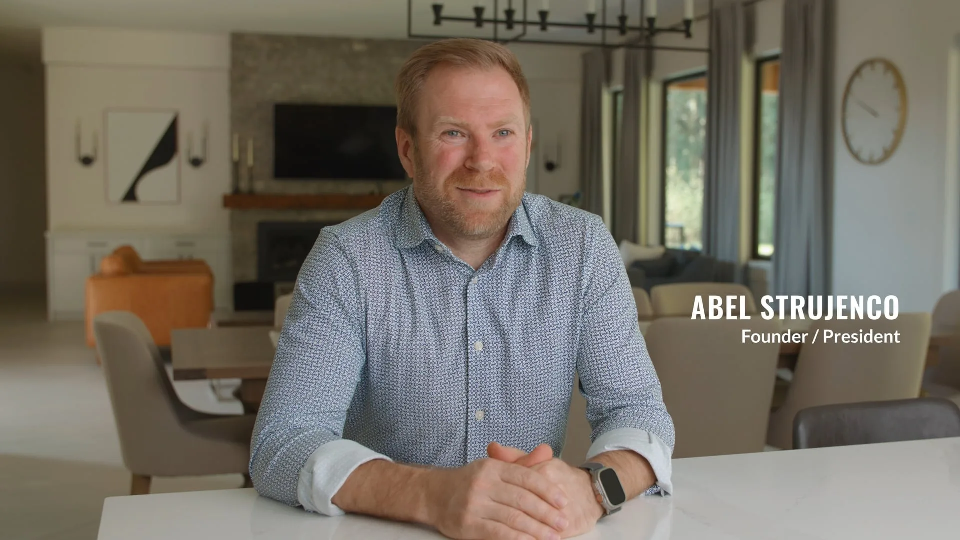 Abel Strujenco, founder of ProStyle, at a kitchen table in a finished home.