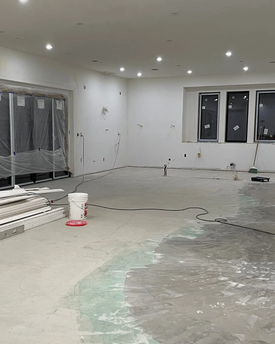 During: the kitchen and great room on the bare concrete slab, before the floors, cabinets and finishes went in.